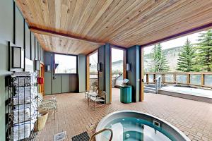 a large room with a jacuzzi tub in a house at Keystone Condo 8380 in Keystone