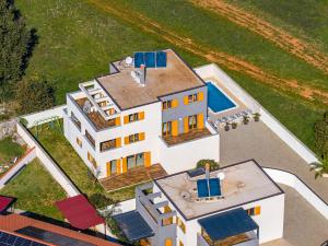 an aerial view of a house with a swimming pool at Villa Palatium for 14 people in Fazana with sauna & jacuzzi only 800 meters from the beach in Valbandon