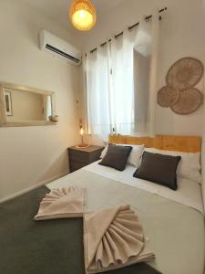 a bedroom with a large bed with a dress on it at Casa cerca de Sevilla, la playa y Doñana in Aznalcázar