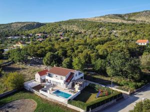 an aerial view of a house with a swimming pool at Holiday Home Marija by Interhome in Primorski Dolac +17 photos