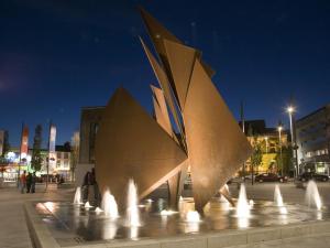 a water fountain in a square in a city at night at Holiday Home Galway Bay - TR4Lodge by Interhome in Doughiska