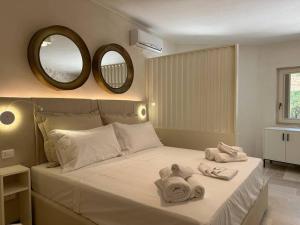 Postel nebo postele na pokoji v ubytování Villa Leonardo Luxury Locorotondo + 45 fotografií