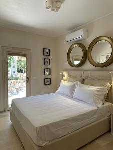 Postel nebo postele na pokoji v ubytování Villa Leonardo Luxury Locorotondo