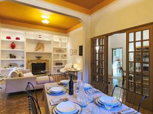 a living room with a table and a couch at Holiday Home La Pausa by Interhome in Ponteginori