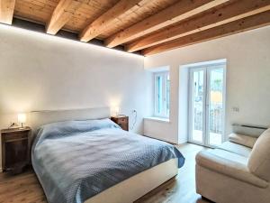 Ένα ή περισσότερα κρεβάτια σε δωμάτιο στο Apartment l'Isola by Interhome