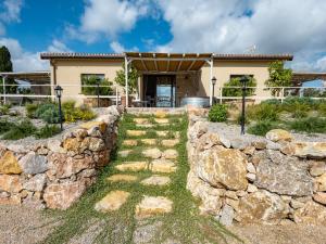 a stone path in front of a house at Holiday Home Poggio Piero 3 by Interhome in Montemassi