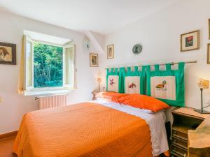Ένα ή περισσότερα κρεβάτια σε δωμάτιο στο Holiday Home Il Mulinaccio by Interhome