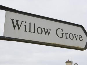 a white sign with the words willow grove on it at Holiday Home Willow Grove HC No- 3 by Interhome in Mervyn
