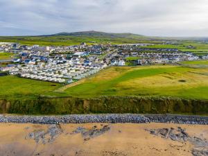 an aerial view of a coastal town with a golf course at Holiday Home Ballybunion - TR4 HC No 27 by Interhome in Ballybunion