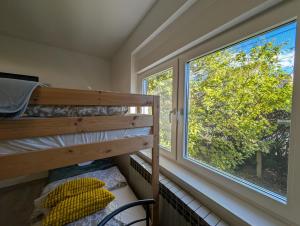 a bedroom with a bunk bed and a window at Cozy Studio in Sesvete in Sesvete