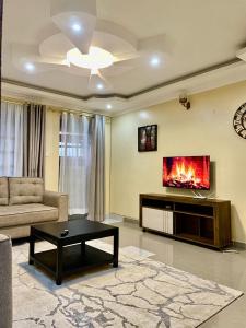 a living room with a couch and a fireplace at Eldoret Cozy Homes - Pioneer in Eldoret