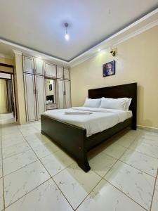 a bedroom with a large bed in a room at Eldoret Cozy Homes - Pioneer in Eldoret +1 photo