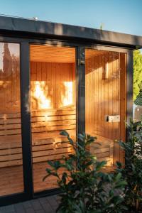 a sauna with wood paneling on a house at Boutique Villa Vanilla in Csopak