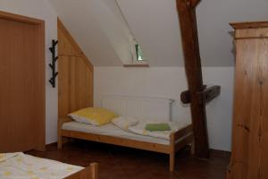 a small bedroom with a bed in a room at Dom przy Rezerwacie in Trzciel +54 photos
