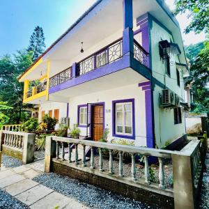 a house with a fence in front of it at The golden villa in Calangute +15 photos