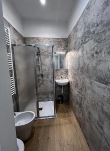 a bathroom with a shower and a sink at Top Rooms Torino in Turin