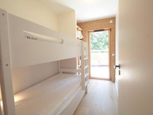 a room with a bunk bed in a house at Appartement ski aux pieds, 3 pièces, 6 pers, terrasse sud, près des Carroz - FR-1-572-248 in Les Carroz d'Araches