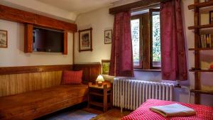 A bed or beds in a room at Penzion Barborka
