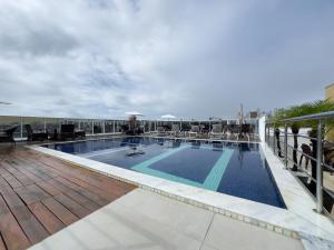 a swimming pool on the roof of a building at Laguna Praia Hotel in João Pessoa