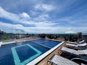 a swimming pool on the roof of a building at Laguna Praia Hotel in João Pessoa +89 photos