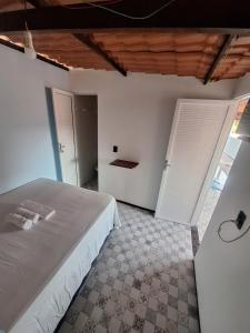 Postel nebo postele na pokoji v ubytování Pousada São João