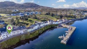 an aerial view of a train traveling along a river at 2 Harbour View in Roundstone