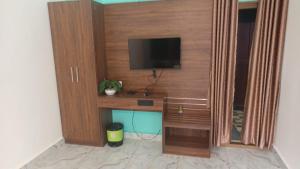 TV a/nebo společenská místnost v ubytování portede munnar