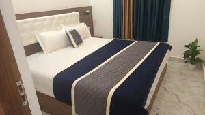 Postel nebo postele na pokoji v ubytování portede munnar