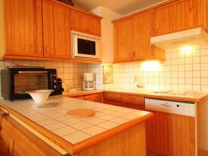 Η κουζίνα ή μικρή κουζίνα στο Studio cosy 4 pers avec parking, lave-vaisselle, balcon, proche des pistes et commerces - FR-1-572-56