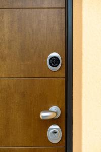 a wooden door with a door knob and a door at Bilocale Gelsomino - Monolocale Bucaneve - Cascina Da Rosa in Capiago Intimiano +56 photos