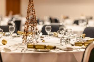 a table with wine glasses and napkins on it at Radisson Blu Hotel, Bristol in Bristol