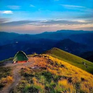 a tent on the top of a mountain at narangala skycamping  +14 photos