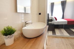 a bathroom with a large white tub in a room at Villa M in Split