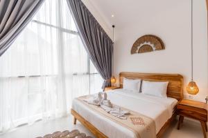 Ένα ή περισσότερα κρεβάτια σε δωμάτιο στο Sunrise Bliss Bali by Bali Bliss Properties