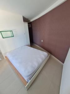 Ένα ή περισσότερα κρεβάτια σε δωμάτιο στο Flat mobiliado e bem localizado