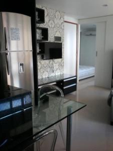 Μια τηλεόραση ή/και κέντρο ψυχαγωγίας στο Flat mobiliado e bem localizado