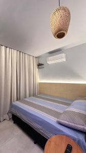 Ένα ή περισσότερα κρεβάτια σε δωμάτιο στο Flat De Maré - Orla de Salvador