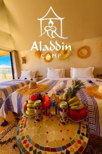 Кровать или кровати в номере Aladdin merzouga camp