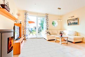 TV a/nebo společenská místnost v ubytování Fewo LampRieger Maisonette rechts