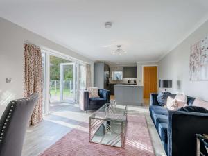a living room with a couch and a table at 1 Bed in Sandyhills 85904 in Fairgirth +15 photos