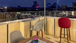 Balkón nebo terasa v ubytování Paradise Pyramids Apartments