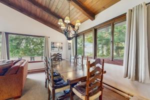 a dining room with a table and some windows at 4 Bed 2 Bath Vacation home in Franconia in Franconia