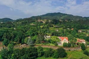 an aerial view of a village on a mountain at The Luxury and Nature Retreat with pool, jacuzzi & BBQ in Vila Fonche
