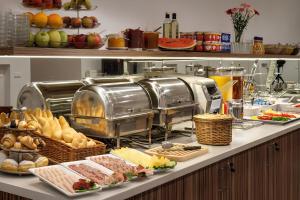 a buffet line with different types of food on it at Annabelle Studio in Batumi