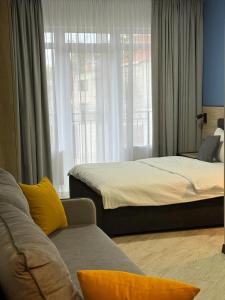 Postel nebo postele na pokoji v ubytování Apartments on Sennaya Street + 12 fotografií