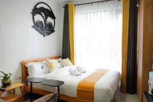 Postel nebo postele na pokoji v ubytování Savannah Residence by Royal Surburbs + 10 fotografií