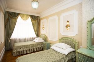 Posteľ alebo postele v izbe v ubytovaní Art Apartments Celakovskeho Sady