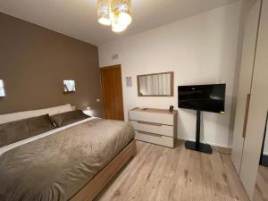 Postel nebo postele na pokoji v ubytování Rosina's Little Apartment