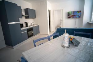 a kitchen with a table with a candle on it at 14 Nevoso Palace in Milan +6 photos