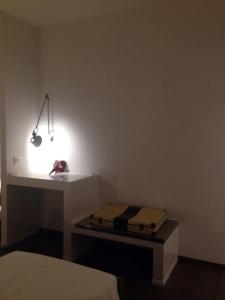 Postel nebo postele na pokoji v ubytování Residenza La Corte Assisi